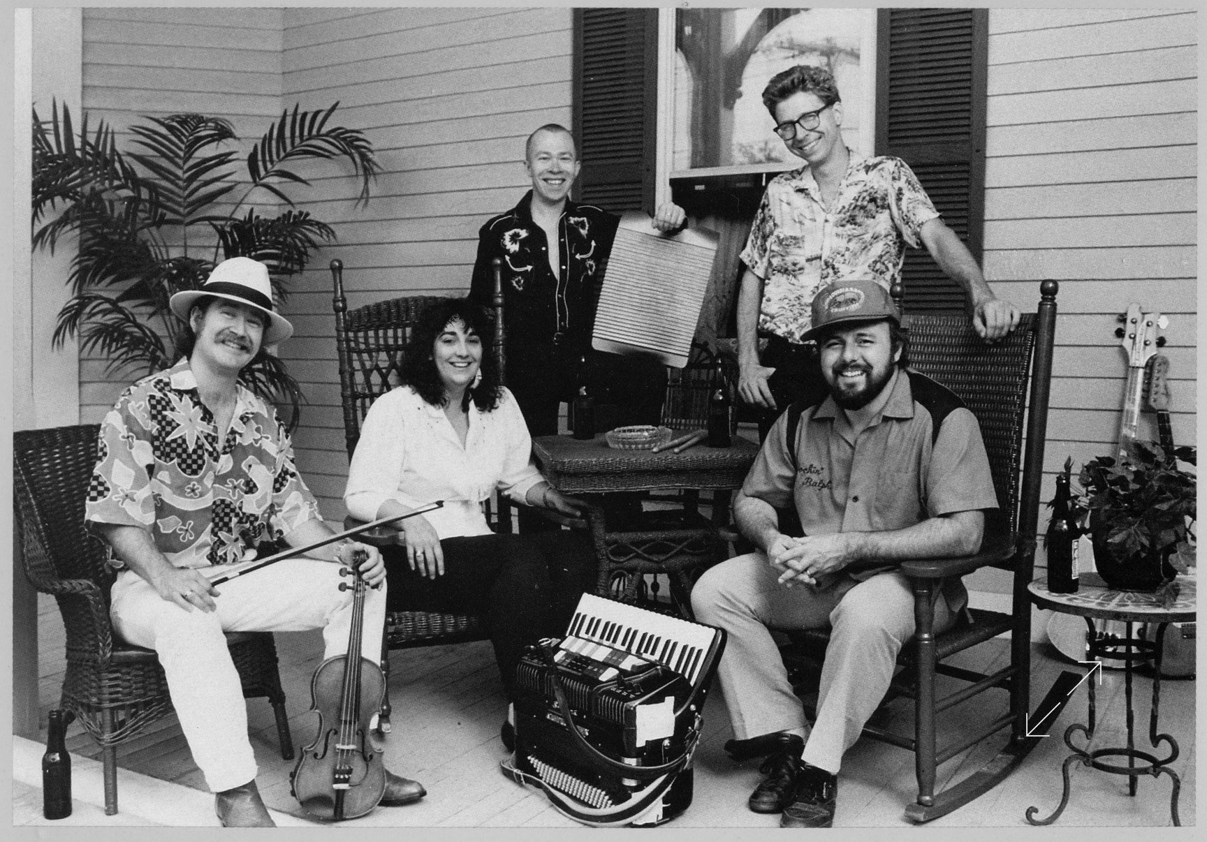 A photo from the album cover of the Boogaloo Swamis band. Ryan Thomson - fiddle, Jeanne Boyer - bass, Micky Bones - percussion, Pete Weatherby - guitar, Ralph Tufo - accordion