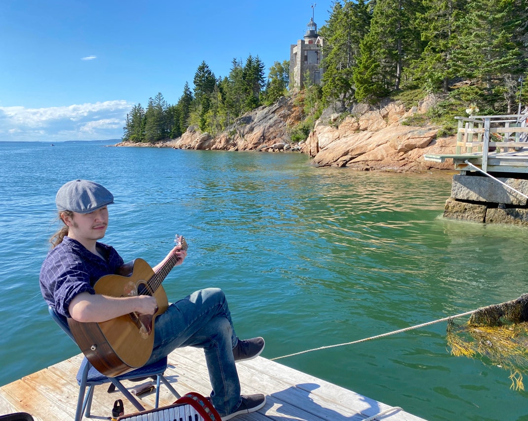 Brennish Thomson, guitarist, on the coast of Maine