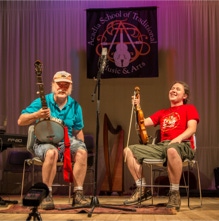 Fiddling Thomsons, Ryan and Brennish, at a humorous moment during their performance at Acadia Trad School, Bar Harbor, Maine