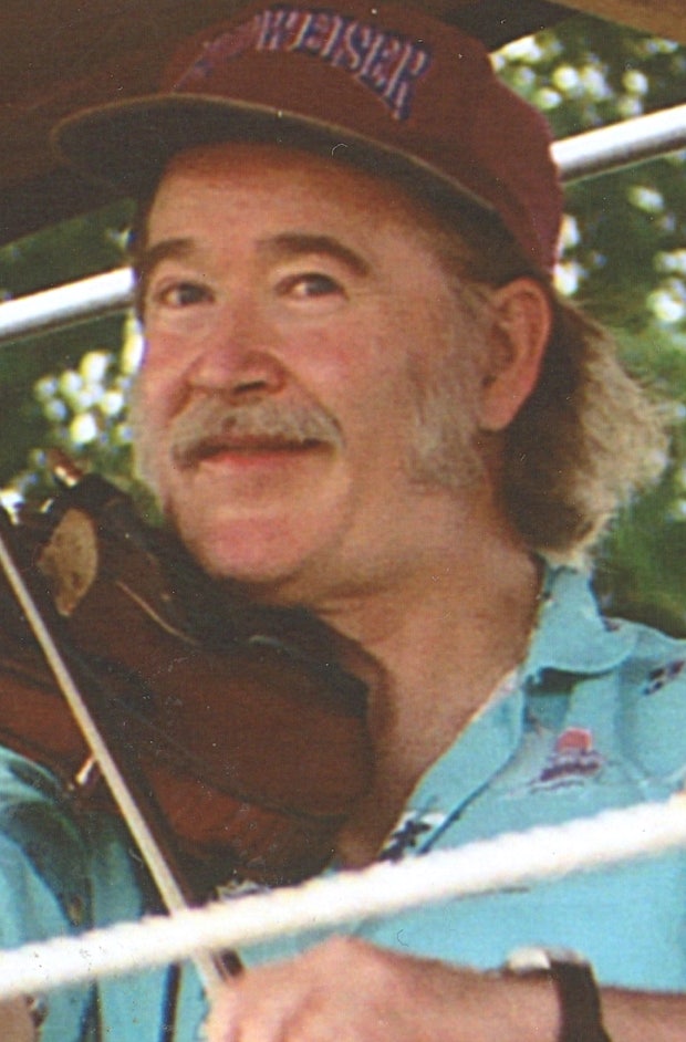 Ryan Thomson, fiddling with the Smoke and Mirrors contra dance band.