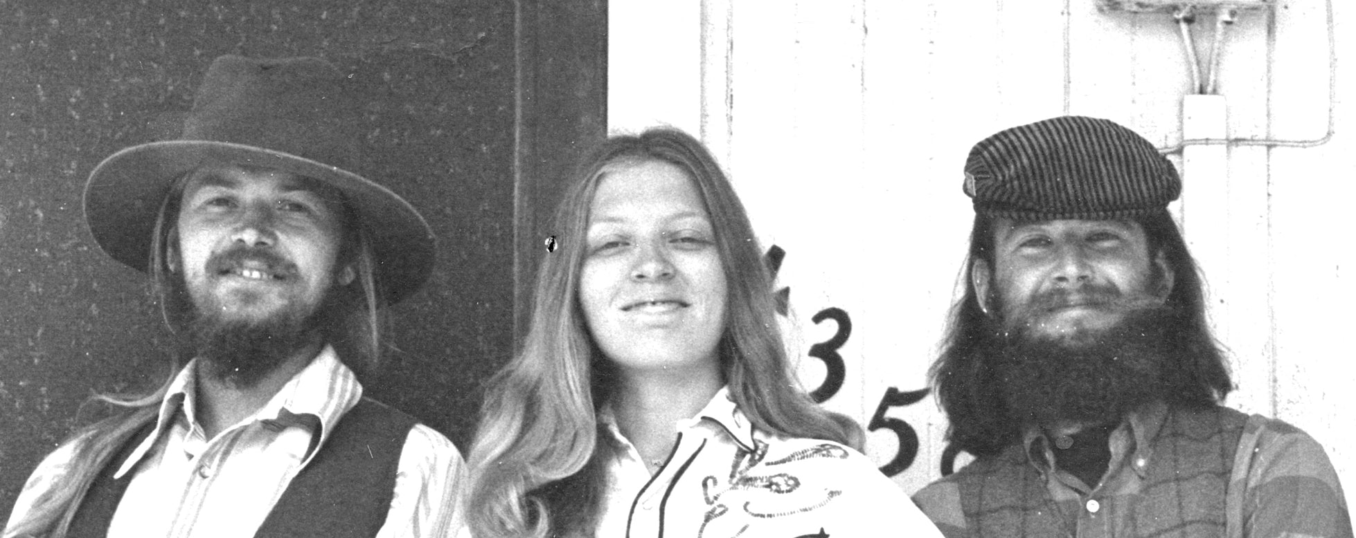 Photo of Dave Brown, Pamela Ostergren, and Ryan Thomson, members of the Chicken Cheek Tweakers old time string band, in La Mesa, California, 1974.