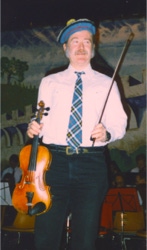 Ryan Thomson, in Scottish clan colors, performs with the New Hampshire Strathspey and Reel Society