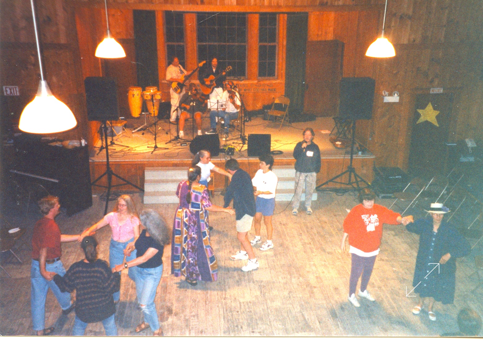 Ryan Thomson calling the Friday night dance at the SAMW music camp in 1987 at Geneva Point, New Hampshire.