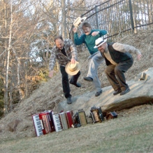 Squeezebox Stompers stomping on their squeezeboxes, Larry, Ryan, and Ralph